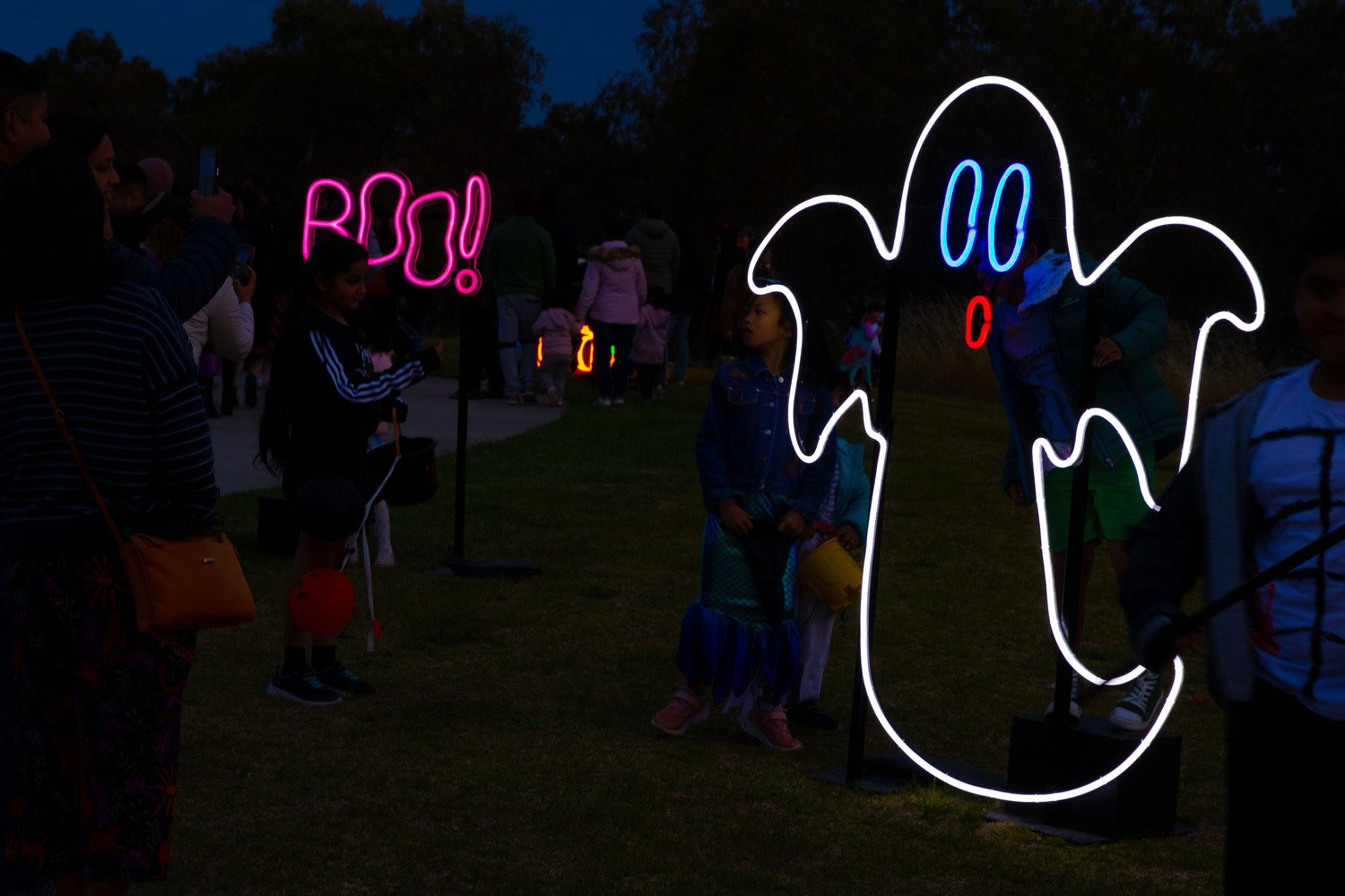 Volter International neon Halloween installation glowing at night